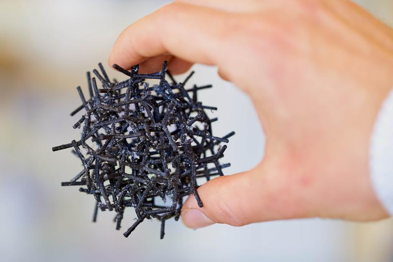 The model shows the filigree internal structure, a network of graphene tubes that makes aerographene so lightweight and conductive.