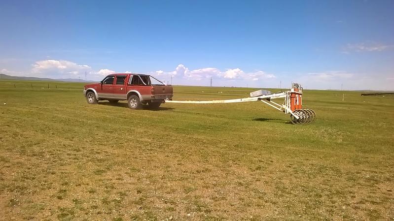 The magnetic field sensors (SQUIDs) pulled by a jeep map the terrain around the ancient capital of the Mongol Empire, which is now hidden under farmland 