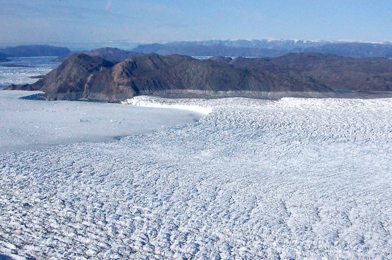 View over the glacier Kangilerngata Sermia (West Greenland), with its front reaching ocean waters in the Disco Bay.