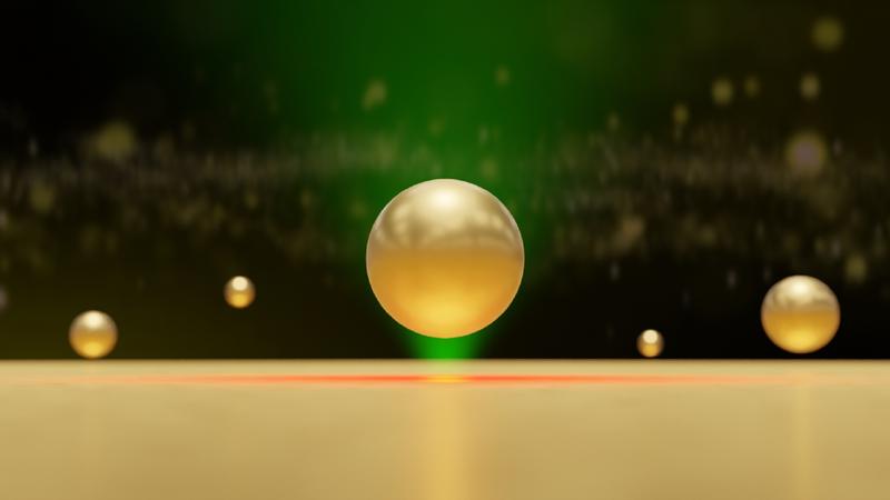 Illustration of a gold nanoparticle trapped near a locally heated gold surface by hydrodynamic and van der Waals forces.