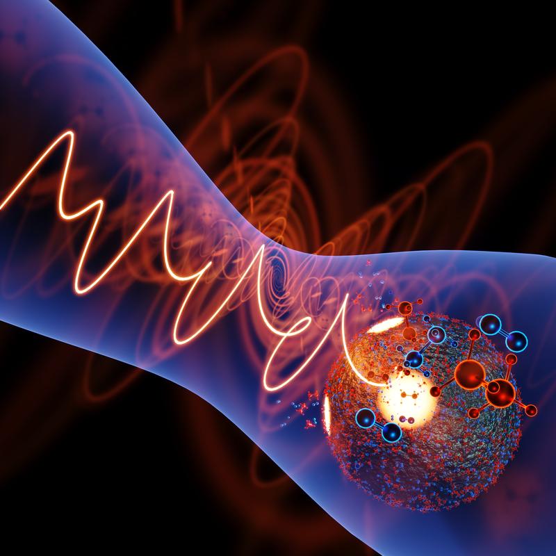 A nanoparticle in the field of a femtosecond laser pulse with tailored waveform and polarization. The controlled enhancement of the field in specific nanoscopic regions of the nanoparticle (yellow spots) induces site-selective photochemical reactions [...]