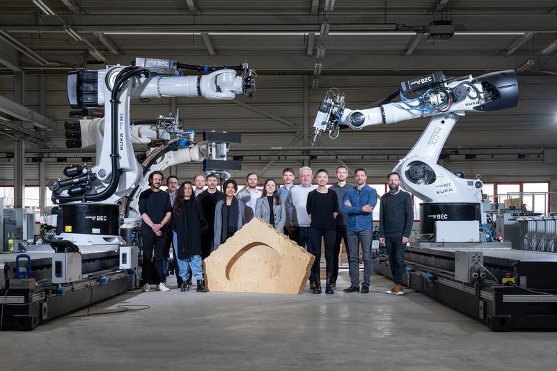 Robotic manufacturing scientists* in IntCDC at the LCRL's timber platform. 