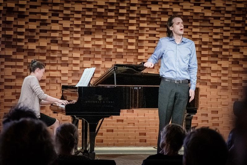 Lea Fink of the MPIEA (piano) and Rafael Bruck (vocals) perform poems set to music in the MPIEA's ArtLab.