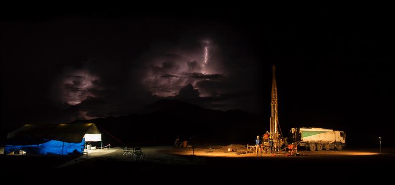 Scientific deep drilling operations in Chew Bahir, southern Ethiopia, during night shift and with remote thunder storms