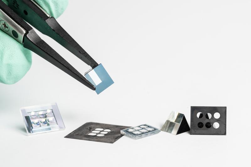 The miniaturized wide-angle 3D camera is only allowed to be 10 mm in size. It is shown here disassembled into its individual optical components. 