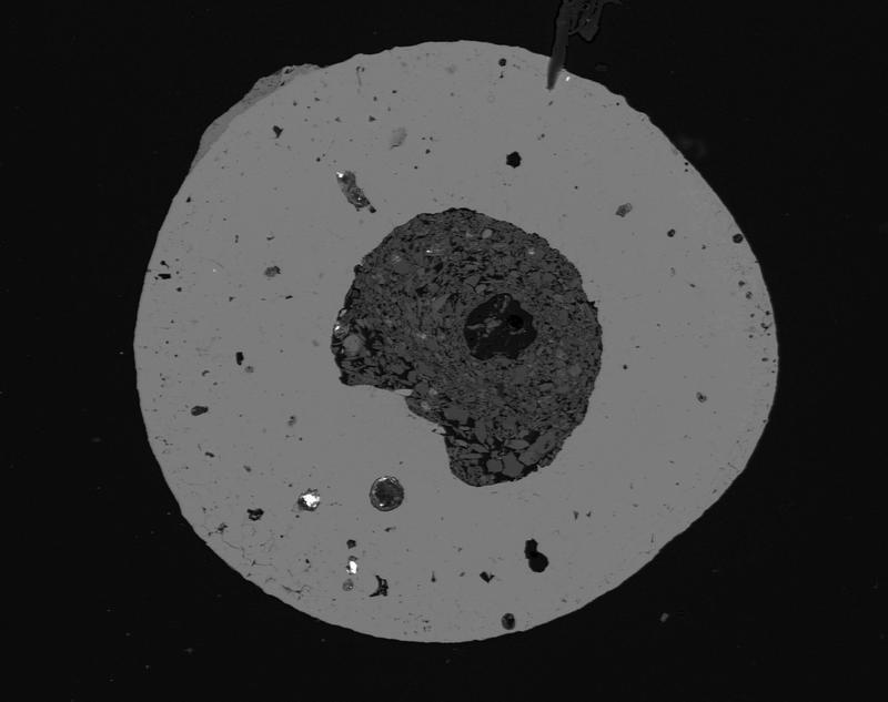 Microsphere from the meteorite: The iron oxide spherule found in the “Domaine du Météore” crater has a core composed of minerals typical for the crater environment and also contains a large number of microdiamonds.