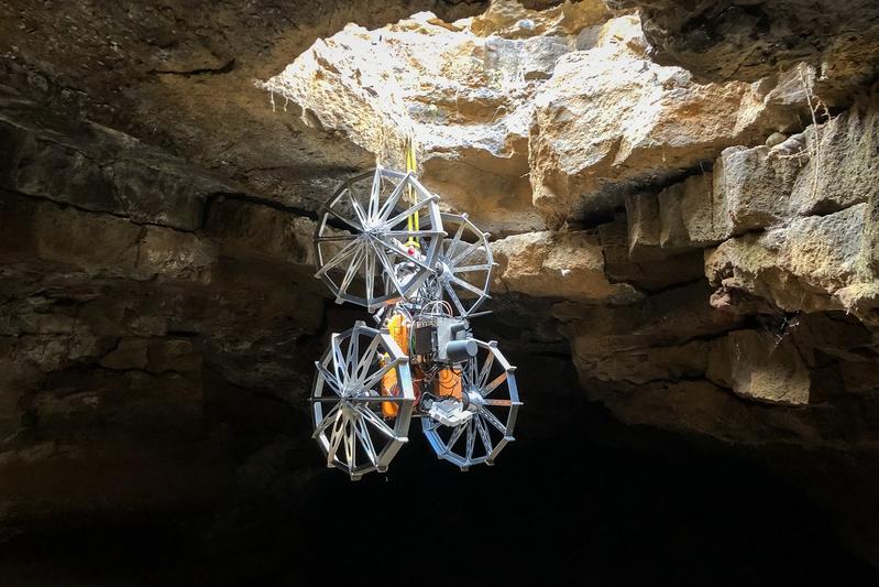 Coyote III rappels down into the cave using a Teather Managment and Docking System provided by SherpaTT.