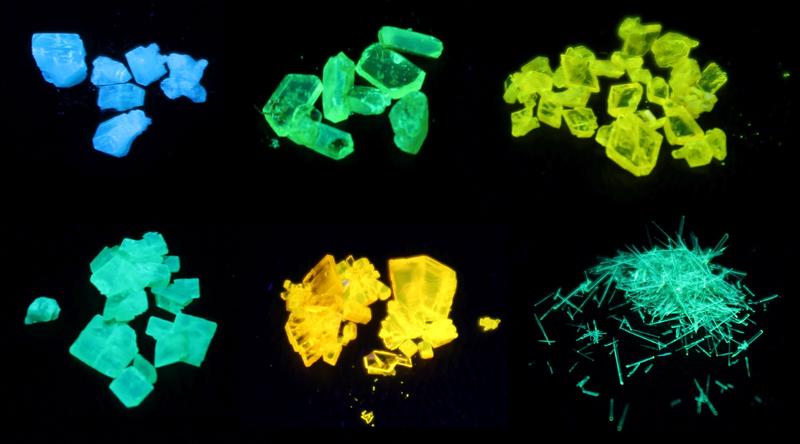 Selected crystals of phosphole-based materials under UV light (395 nm).