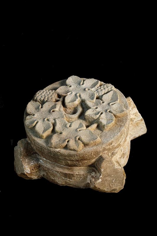 Keystone of the former cloister vault with vine leaves and grapes, first half of the 14th century. 