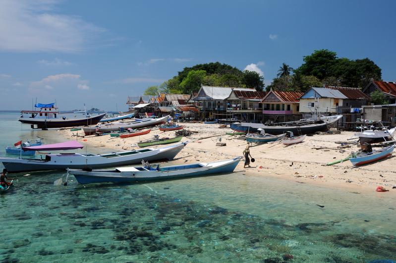Millions of people in the tropics are active in coral reef fisheries, especially in Indonesia. Here, fishing boats on an island in the Spermonde Archipelago, South Sulawesi 