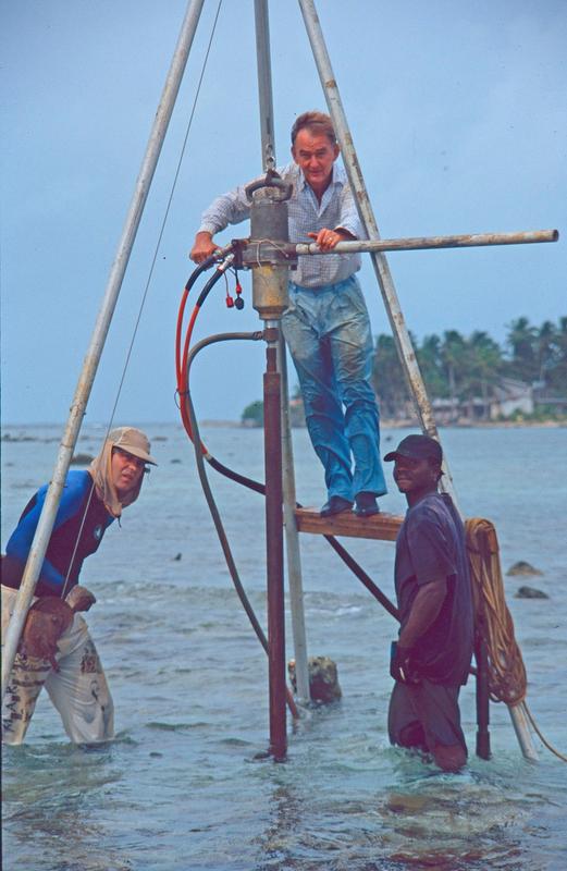 Eberhard Gischler (left; on winch), Harold Hudson (center; on tripod) and Belizean assistant Eric Vasquez coring using a hydraulic rotary drill on the pavement of the Belize Barrier Reef. 