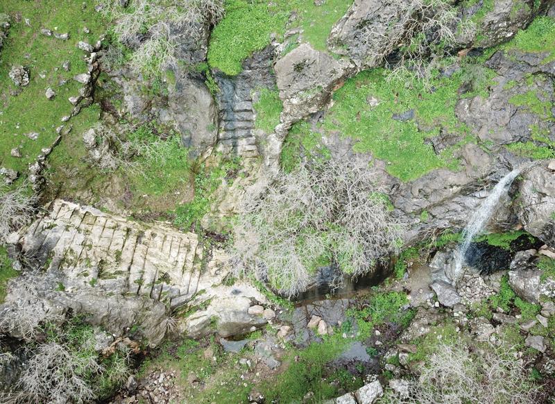 Ephemeral waterfall with main staircase and wadi (April 2019).