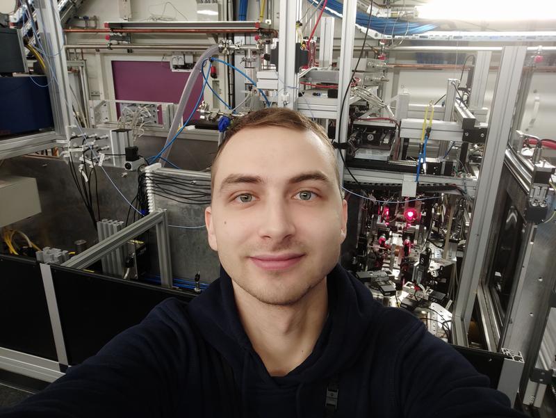 PhD student Andrey Aslandukov in the experimental hutch of the synchrotron radiation facility.
