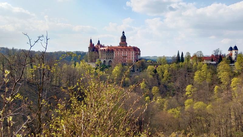View of Książ Castle (in German: Schloss Fürstenstein) from the viewing platform. “Fürstensteiner Grund” is located below the castle in a deeply indented valley.