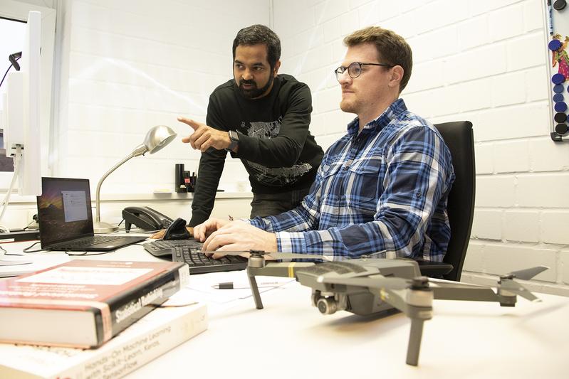 Research using consumer-grade drones: Dr. Arjun Chennu (left) and Daniel Schürholz