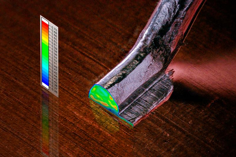 Sheared aluminium heavy wire bond with 300 µm diameter on copper substrate and measured indentation hardness distribution in the cross-section.