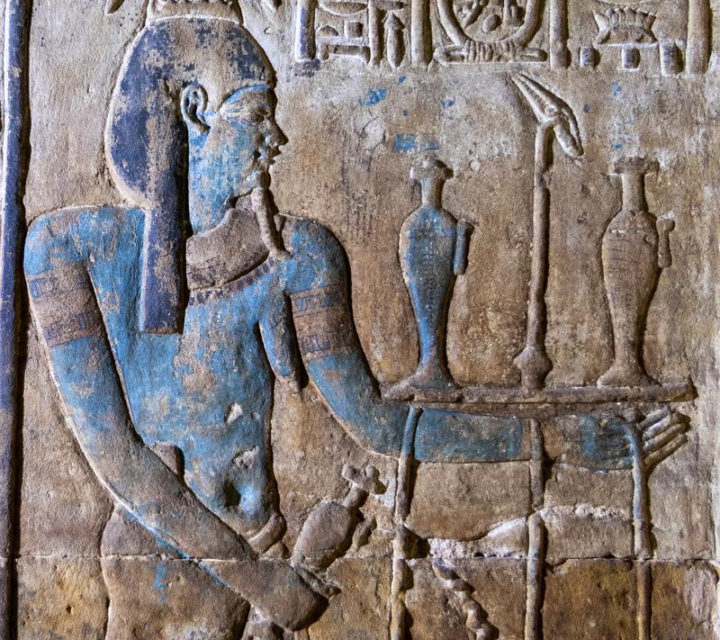 Example of the colourful paintings after the restoration: Nile god with further painted details (jewellery, pupil) and flowers painted on the offering tray.