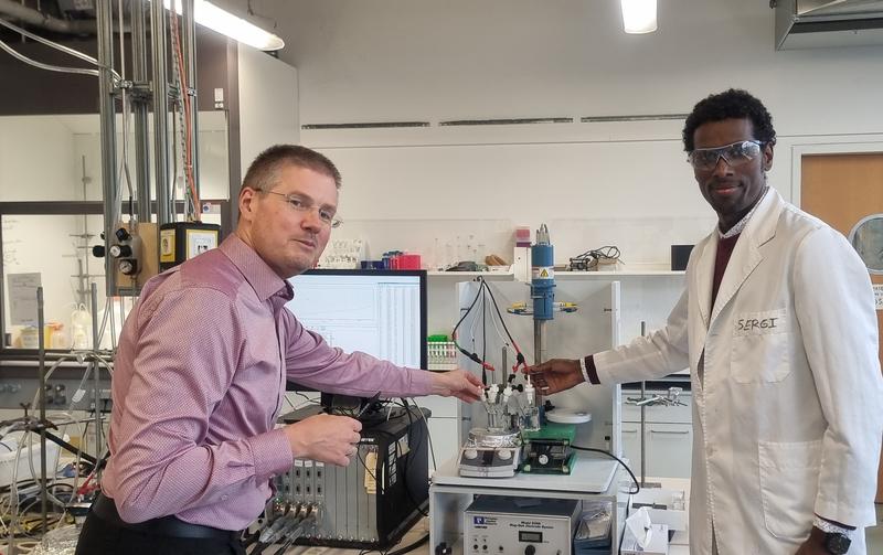 Professor Carsten Streb (left) and Dr. Soressa Abera Chala scrutinizing the process of conversion of carbon dioxide to ethanol in the lab