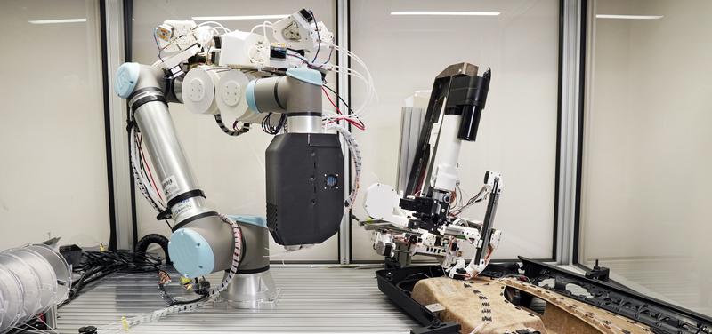 Cable laying with AuCA. The AuCA system consists of two tools (cable laying, left in the image, and contact attachment, right) that can be guided by collaborative robots. The end effector "Cable Deposition" allows for cable feed from an endless roll.