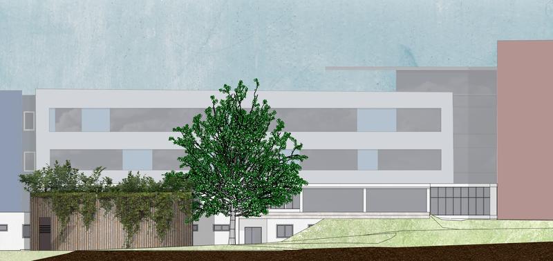 Das Technologie-Innovations-Labor ist direkt an die Klinik für Strahlenheilkunde (Hintergrund) des Universitätsklinikums Freiburg angebunden. Durch sein begrüntes Dach fügt es sich harmonisch in das Klinikgelände ein.