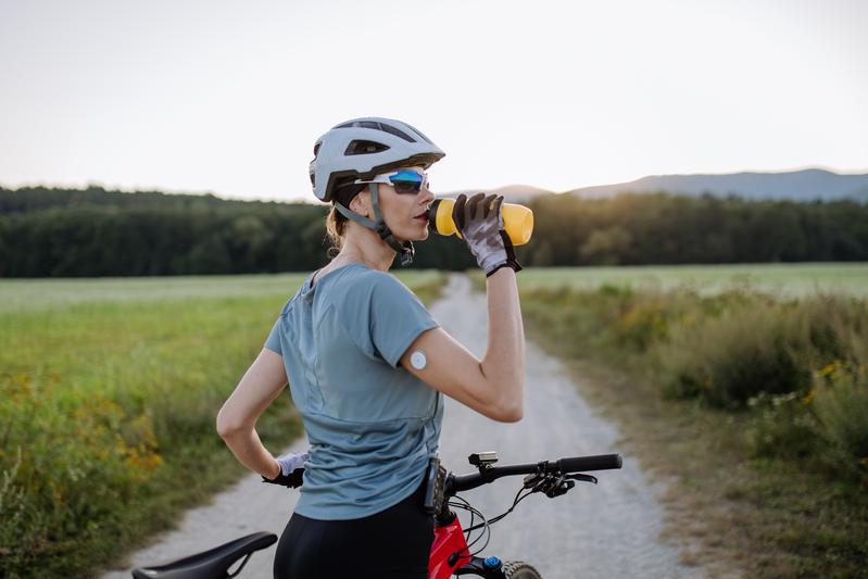 Cyclist with an automated insulin delivery (AID) system.