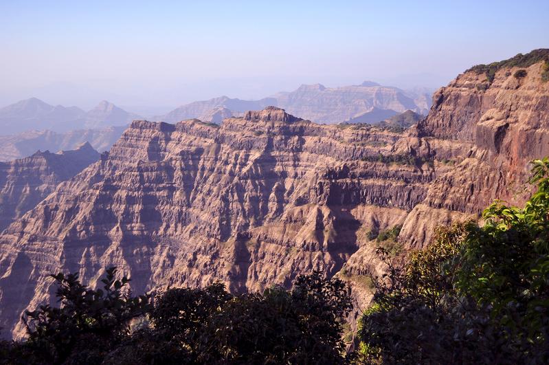 Thick basaltic rock sequences of the West Indian Deccan Trap volcanic rocks.