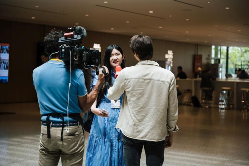 Young Scientist talking to media representatives