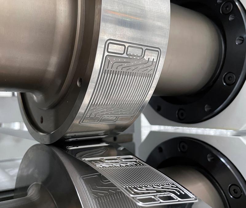 The main advantage of hollow embossing is its continuous process, enabling high throughput at low costs. The image shows Bipolar plate production with BPPflexROLL..