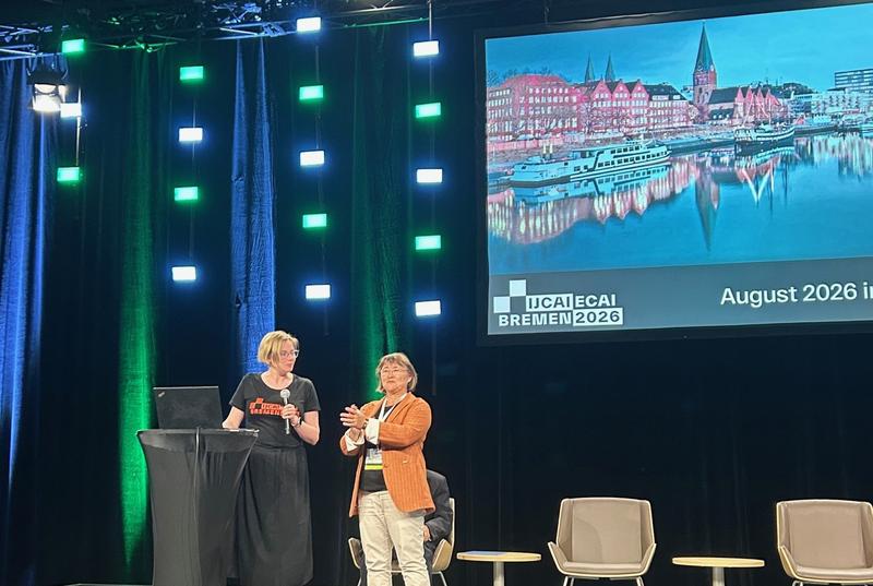 Local Arrangements Committee (LAC) Chair Prof. Dr.-Ing. Tanja Schultz (Universität Bremen) sowie Co-Chair Dr.-Ing. Monika Michaelis (UBRA) stellen Bremen als Veranstaltungsort für die IJCAI-ECAI 2026 bei der IJCAI 2025 in Montréal vor.