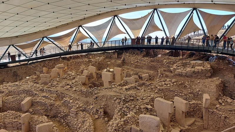 A protective roof and walkway help to conserve the site.