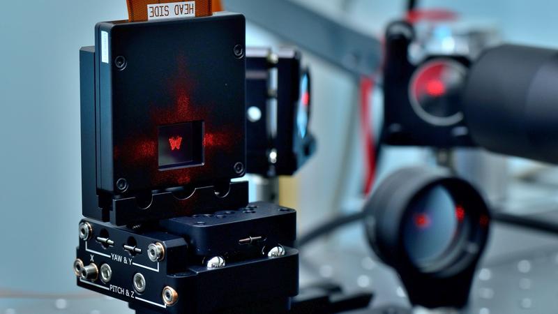 With the optical stamping process, the beam of an ultrashort pulse laser can be precisely shaped into the desired pattern, such as a butterfly in this image. This allows microstructures to be created precisely, reproducibly and in a very short time.