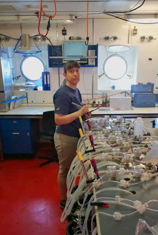 Ana Fernández Carrera conducting lab work aboard the German research vessel METEOR during an expedition along the Amazon river plume